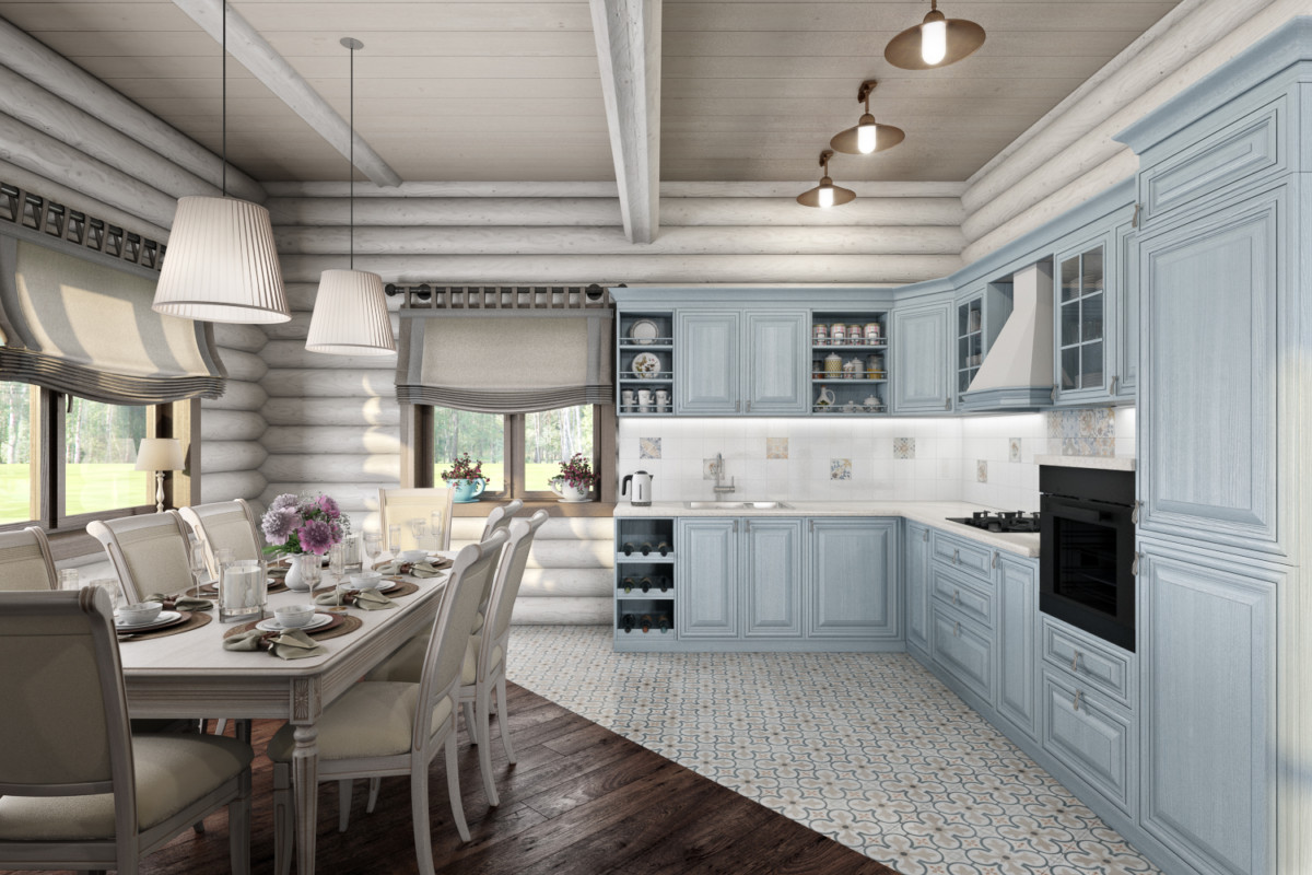 Серо-голубая кухонная мебель смотрится необычно, контрастируя с цветом стен и всего интерьера. Стол из массива дуба серого цвета с бронзовой патиной.
